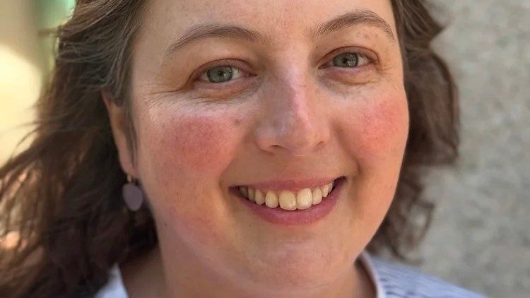 A portrait of artist Josephine Halvorson, a middle aged white woman with dark brown hair and hazel eyes.