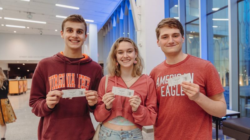 vt-students-tickets Virginia Tech students hold tickets in the Grand Lobby before a performance.
