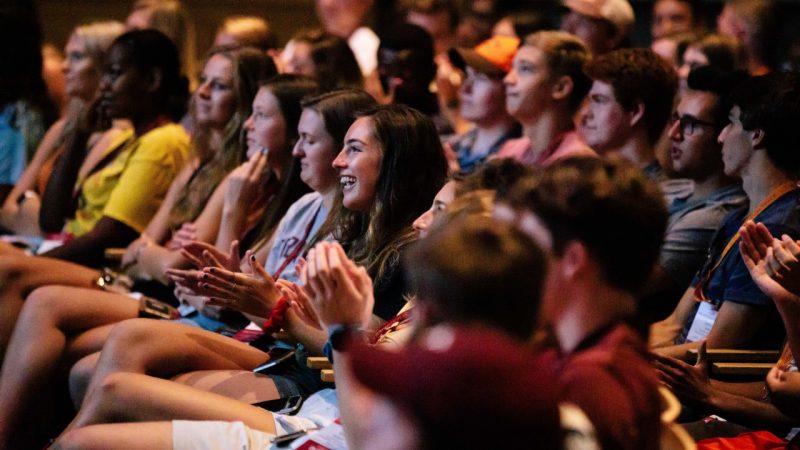 Virginia Tech students applaud during an event at the Moss Arts Center