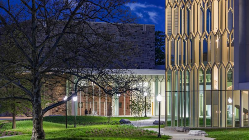 Virginia Tech, Center for the Arts Front entrance of the Moss Arts Center. The building is lit up, with the honeycomb windows giving a soft yellow glow