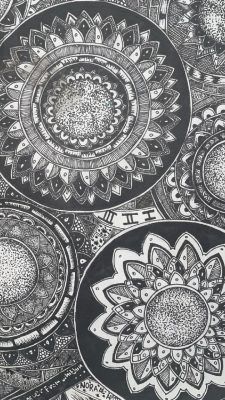  A black and white MICRON pen drawing by Noora AlAmiri of mandalas of different shapes and sizes.