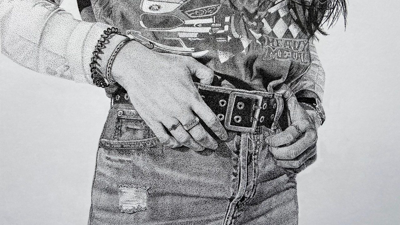  A black and white pen on paper drawing by Natalie Smith of the torso of a young woman. She wears high waisted jeans, black belt, and tucked in concert T-shirt. The edges of her long dark hair are visible hanging down over her left shoulder. She grasps her belt with both hands, and she is wearing rings on her fingers and hair ties on her right wrist.
