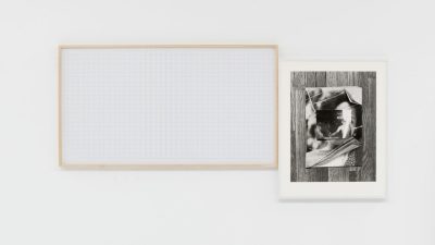 Leslie Hewitt's "Riffs on Real Time with Ground (Green Mesh)," 2017, digital chromogenic print and silver gelatin print, courtesy of the artist and Perrotin. At left, what appears to be grid paper is framed in a rectangular raw wood frame, and at right, what appears to be collaged and stacked black and white photographs sit on top of a hardwood floor, also photographed in black and white.