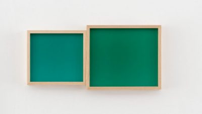 Leslie Hewitt's "Blue Green, Blue Green Yellow, Sometimes," 2022, chromogenic prints, courtesy of the artist and Perrotin. Two works framed in raw wood frames. At right, a square of a blue-based teal, at right a larger slightly horizontal rectangle of a blueish forest green.