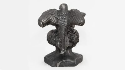 Abigail Lucien's "If I Should Stay," 2023, a cast iron figure of the back of a bird with its wings outstretched atop a bouquet of flowers, courtesy of the artist.