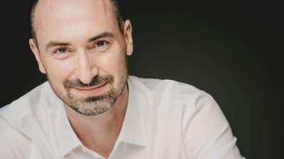 Irish Baroque Orchestra Artistic Director Peter Whelan, a bald white man with a dark brown beard.