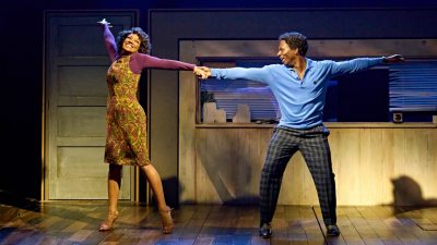 Cast members of "TINA – The Tina Turner Musical" perform on stage.