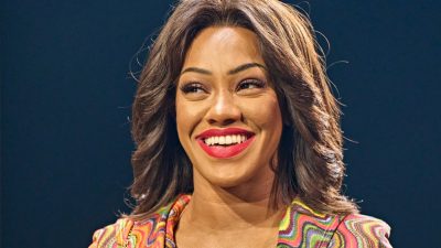 A cast member of "TINA – The Tina Turner Musical" performs on stage.