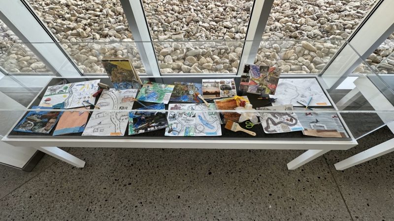 PK12 students' drawings and collages on display as part of a Community Art Project, "Mapping My Story."