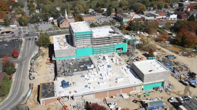 An aerial view of the Moss Arts Center under construction, looking from the upper quad towards Turner Street and Main Street.