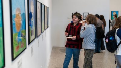 Shawsville Middle School student artists enjoy viewing their art on the Ruth C. Horton Gallery walls during a free opening reception for "Young Artists: Layers of Me" at the Center for the Arts.