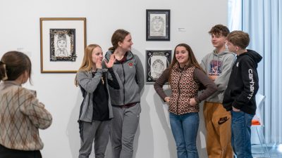 Shawsville Middle School student artists enjoy viewing their art on the Ruth C. Horton Gallery walls during a free opening reception for "Young Artists: Layers of Me" at the Center for the Arts