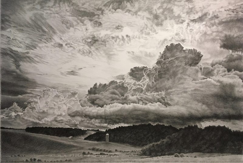 Mary Lee Ruff's work, "Rolling Thunder," 2022,  graphite pencil on paper. This highly detailed pencil drawing shows a dramatic rural landscape beneath a vast, cloud-filled sky. The sky dominates the composition, filled with layered, textured clouds ranging from light and wispy to dark and dense, suggesting an approaching storm. Below, gently rolling fields lead to a tree-lined ridge with a small silo and a barn visible in the midground, adding scale and depth to the serene yet powerful scene.