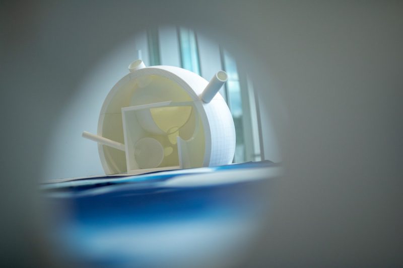 A Light and Shadow Instrument rests on a cyanotype print. Photo by Rodney Kimbangu for Virginia Tech.